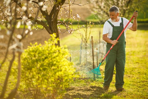 Gardening team inspecting plants and taking notes in a residential garden